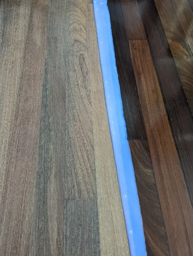 Hardwood floor finish application — wet coat being applied by 3 Floor Guys in Orlando